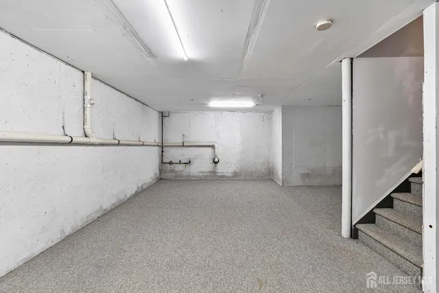 a view of a storage & utility room with stairs