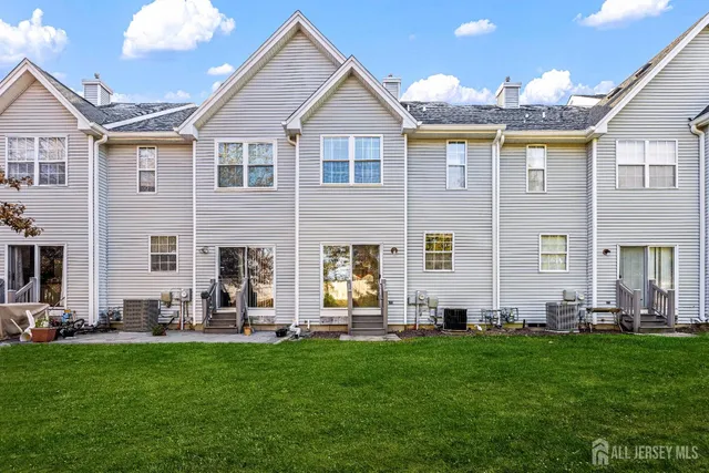 a front view of house with yard and outdoor seating