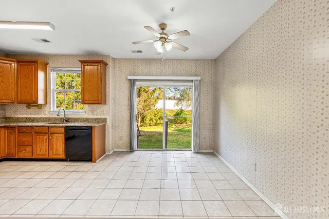 a view of a kitchen with a sink and a window