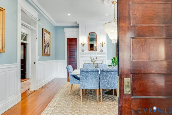 a view of a dining room with furniture window and wooden floor