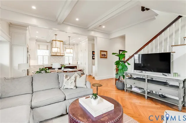 a kitchen with stainless steel appliances granite countertop a stove and white cabinets