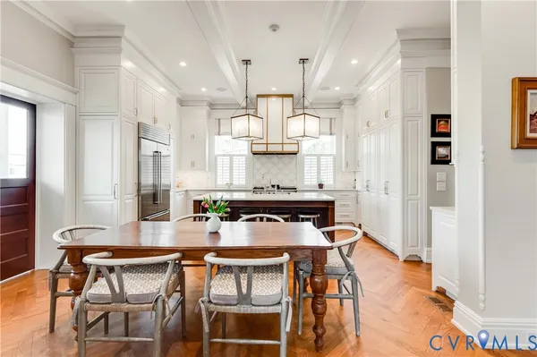 a kitchen with a table and chairs in it
