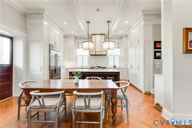 a kitchen with a table and chairs in it