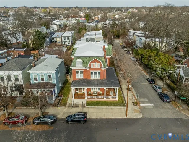 an aerial view of a residential apartment building with a yard