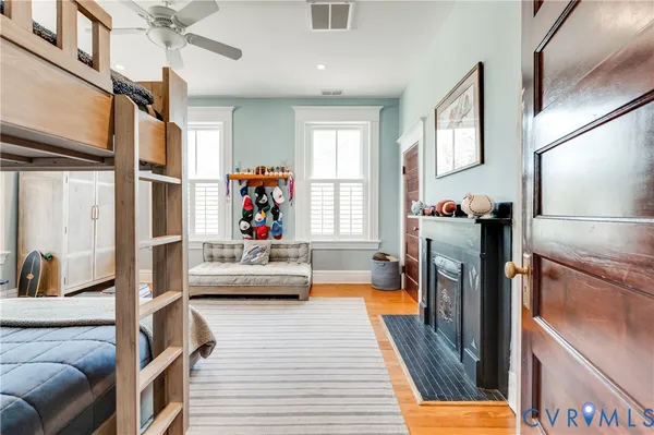 a bedroom with furniture and a large window