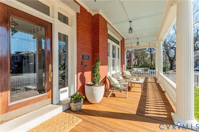 a view of a patio with dining table and chairs