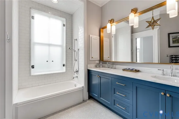 a bedroom with a bed closet and a large window