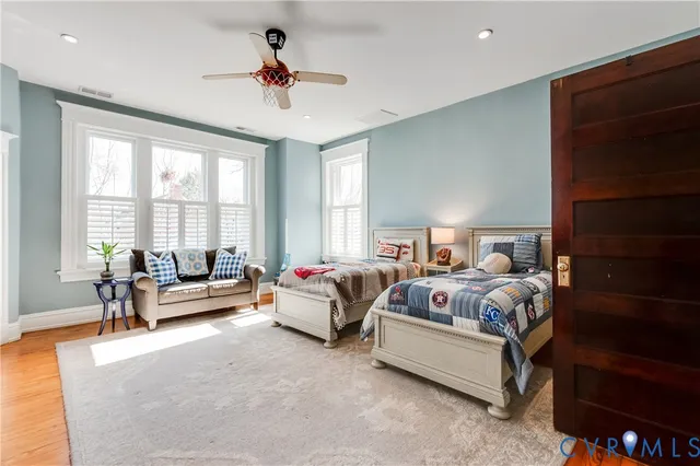 a white bath tub sitting next to a window