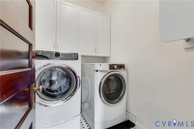 a spacious bathroom with double vanity a large mirror a bathtub and a sink