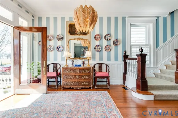 a living room with furniture a fireplace and decor