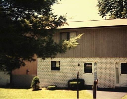 24 Cedarbrook Road, Unit 24 Brookfield, CT 06804 - Photo 1 of 1 a front view of a house with yard