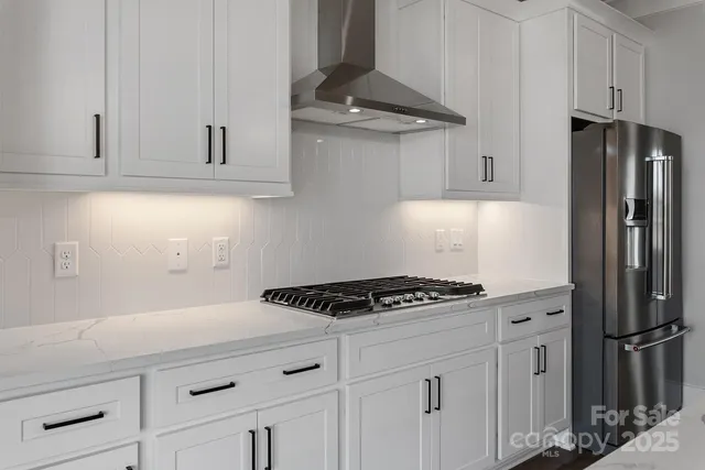 a kitchen with cabinets and appliances