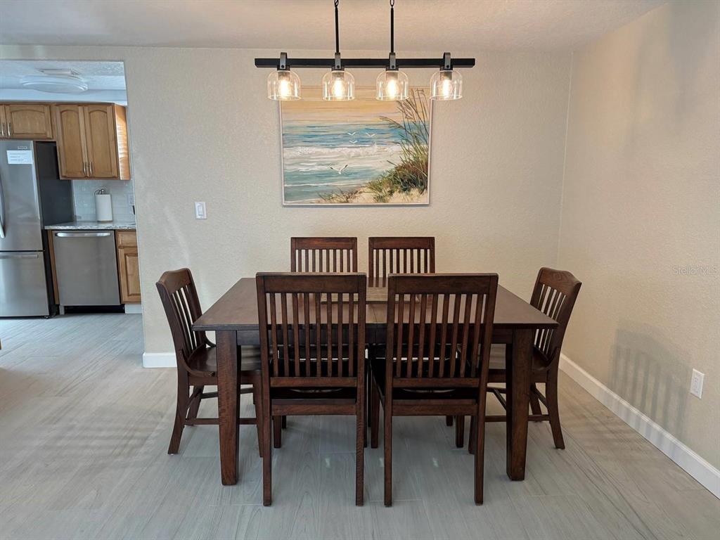 6154 Midnight Pass Road, Unit C15 Sarasota, FL 34242 - Photo 3 of 9 a view of a dining room with furniture window and outside view