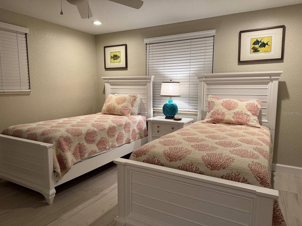 6154 Midnight Pass Road, Unit C15 Sarasota, FL 34242 - Photo 7 of 9 a bedroom with a bed and window