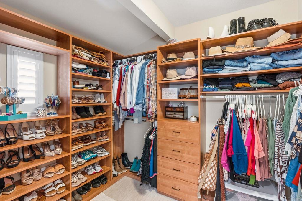 809 Dolphin Circle Encinitas, CA 92024 - Photo 41 of 71 a view of walk in closet with clothes and shoes