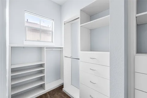 a view of an empty walk in closet
