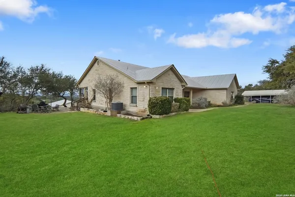 a view of an house with backyard porch and garden