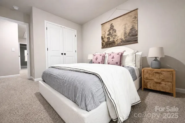 a spacious bedroom with a bed and a couch