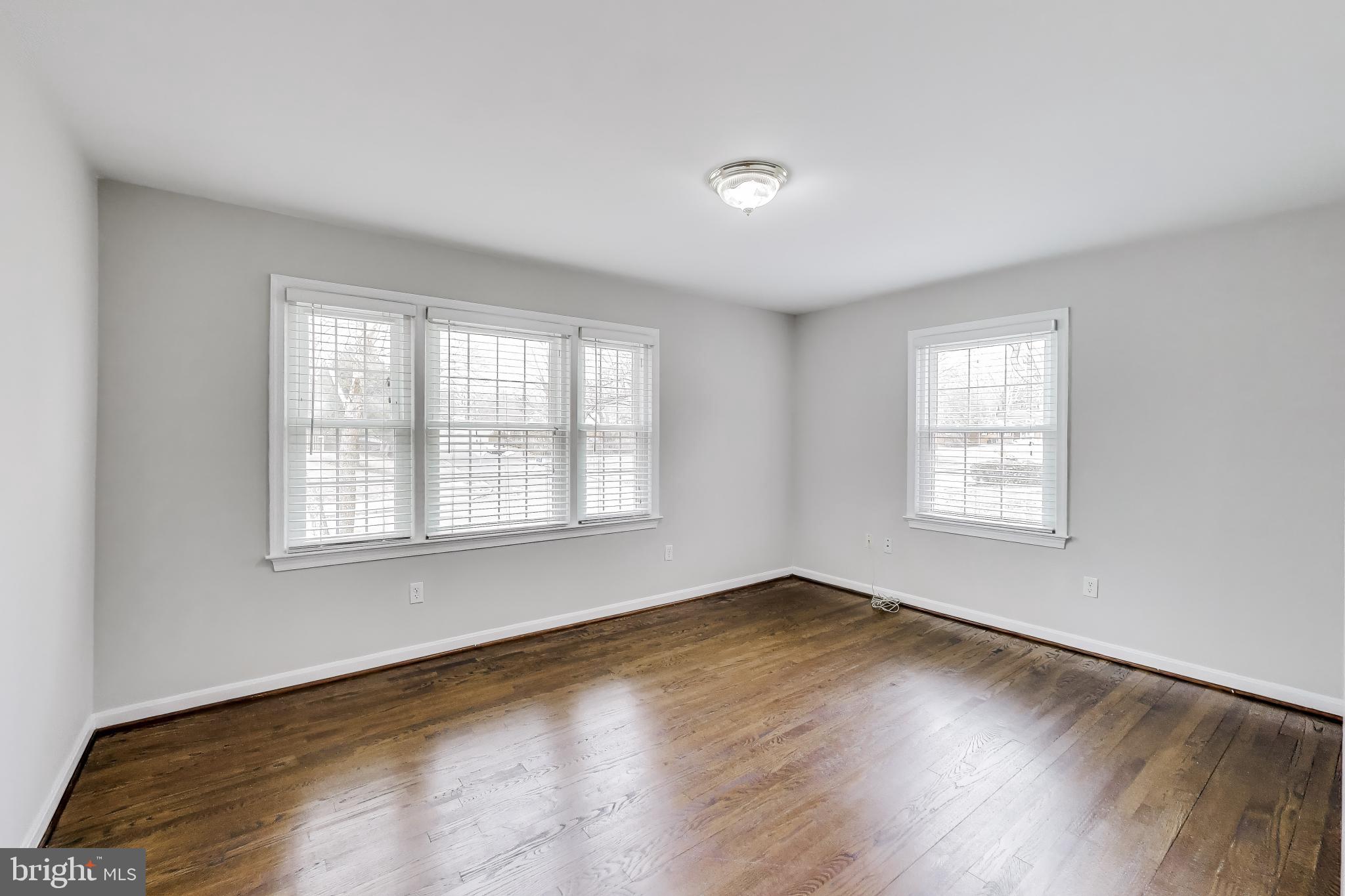 5300 Easton Drive Springfield, VA 22151 - Photo 15 of 60 a view of an empty room with wooden floor and a window