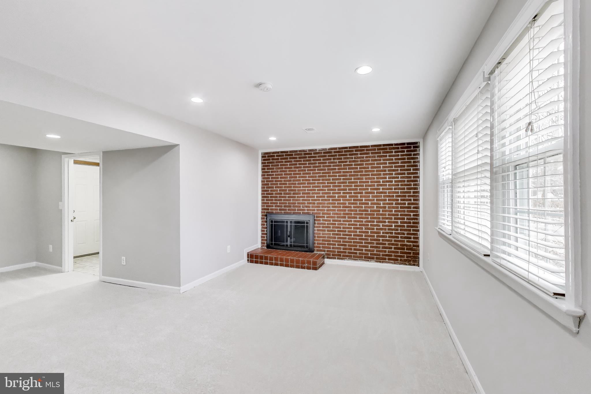 5300 Easton Drive Springfield, VA 22151 - Photo 26 of 60 a view of an empty room with a fireplace and a window
