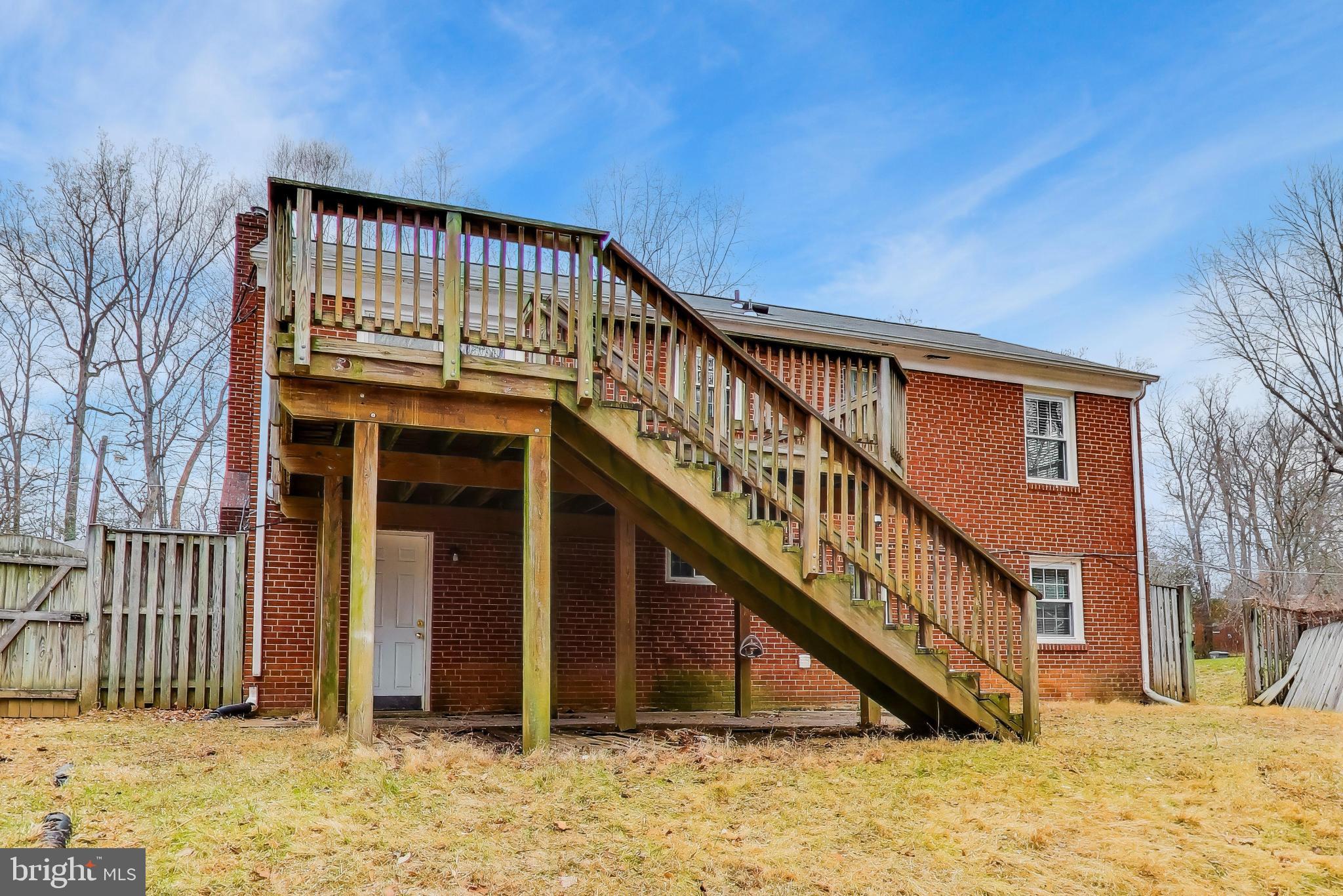 5300 Easton Drive Springfield, VA 22151 - Photo 49 of 60 a view of wooden house with large windows and a small yard