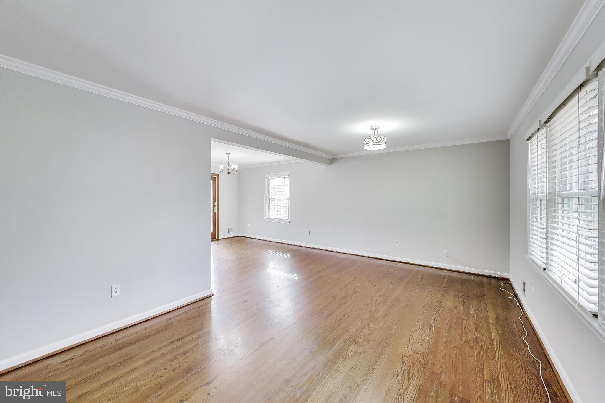 5300 Easton Drive Springfield, VA 22151 - Photo 6 of 60 wooden floor in an empty room with a window