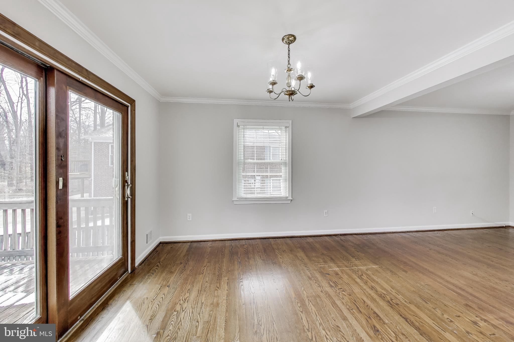 5300 Easton Drive Springfield, VA 22151 - Photo 9 of 60 a view of a livingroom with wooden floor and a large window