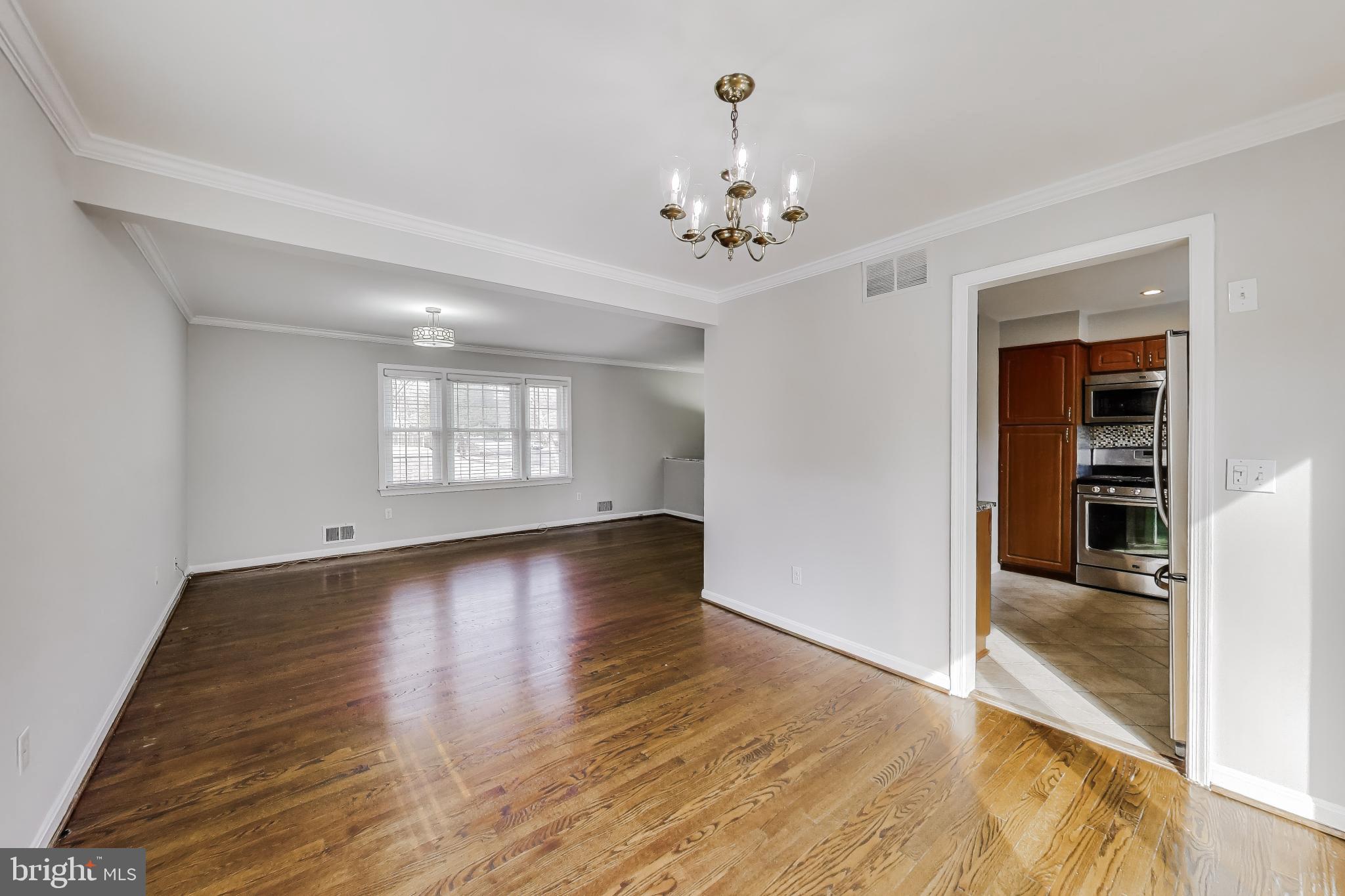 5300 Easton Drive Springfield, VA 22151 - Photo 10 of 60 wooden floor in an empty room with a window