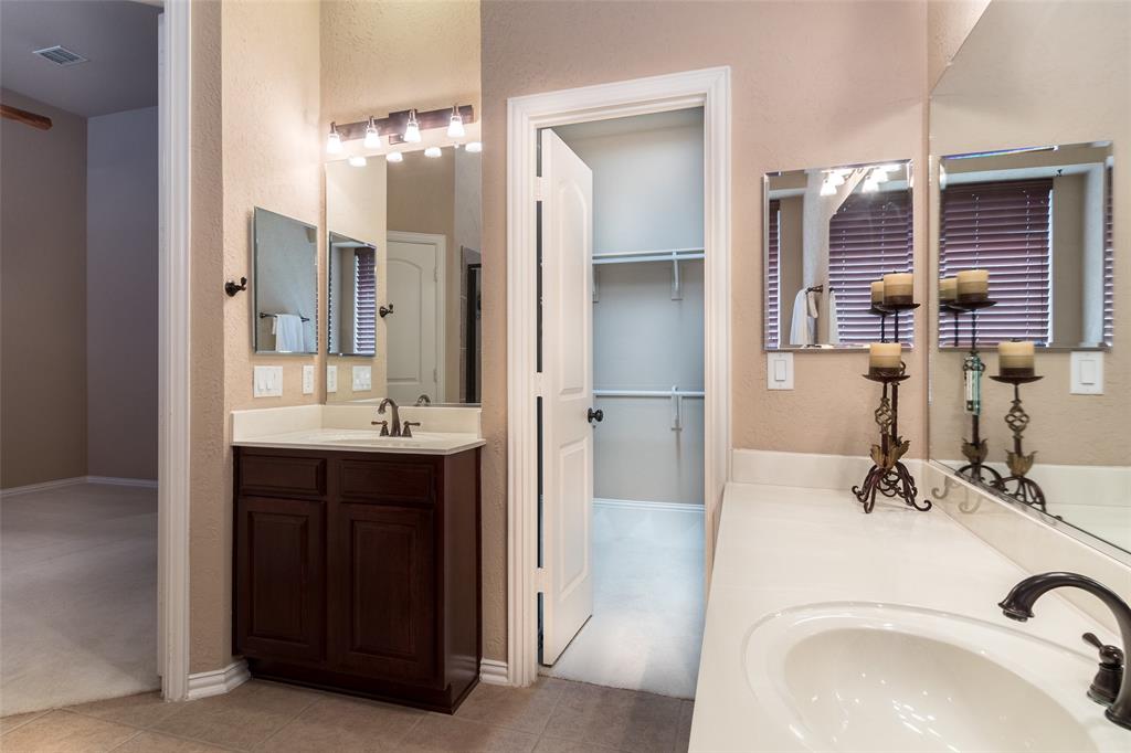 911 Panther Lane Allen, TX 75013 - Photo 14 of 20 a bathroom with a sink and a mirror