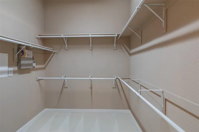 a view of an empty walk in closet