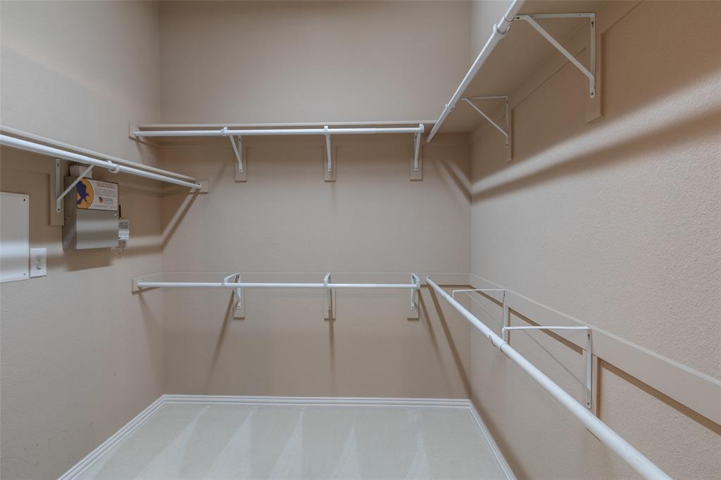 911 Panther Lane Allen, TX 75013 - Photo 15 of 20 a view of an empty walk in closet