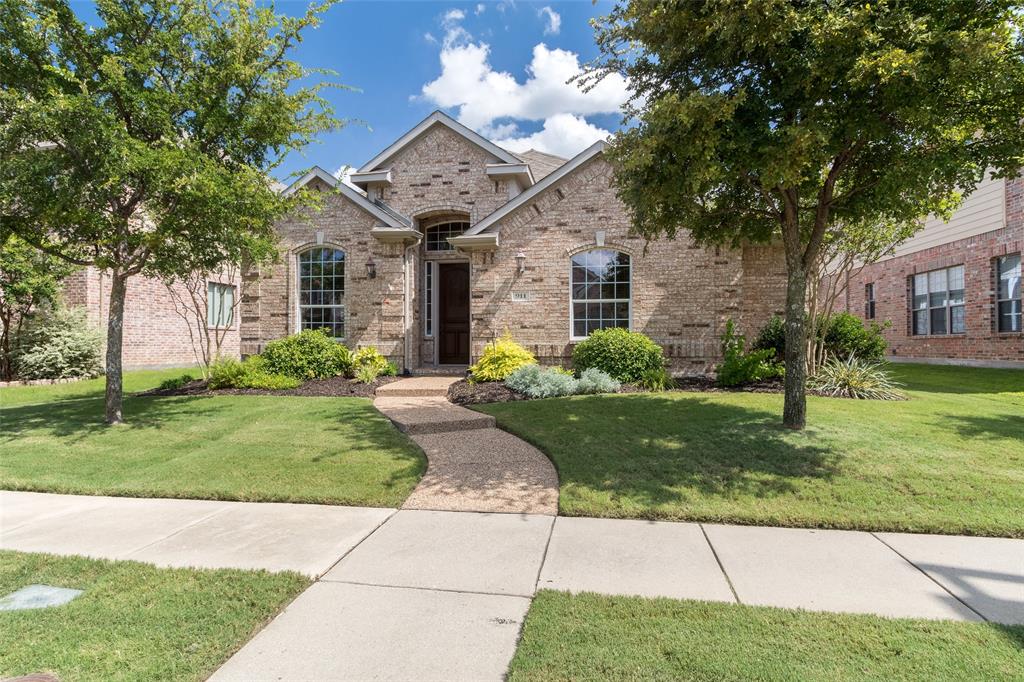 911 Panther Lane Allen, TX 75013 - Photo 2 of 20 a front view of a house with garden