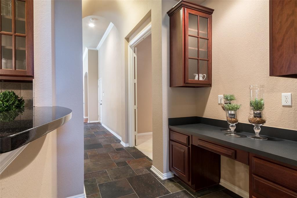 911 Panther Lane Allen, TX 75013 - Photo 5 of 20 a kitchen with stainless steel appliances granite countertop a sink and a granite counter tops