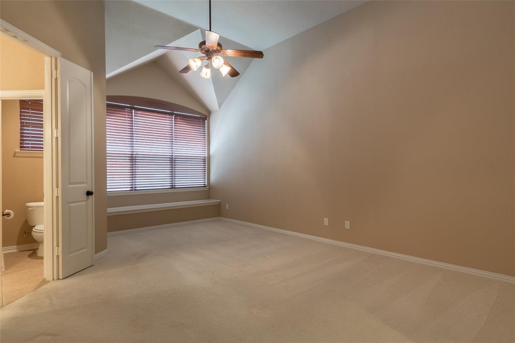 911 Panther Lane Allen, TX 75013 - Photo 10 of 20 an empty room with chandelier fan and windows