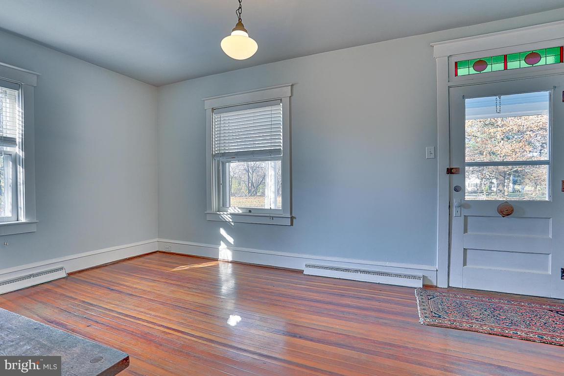 181 Windover Turn Lancaster, PA 17601 - Photo 9 of 58 a view of empty room with wooden floor and fan
