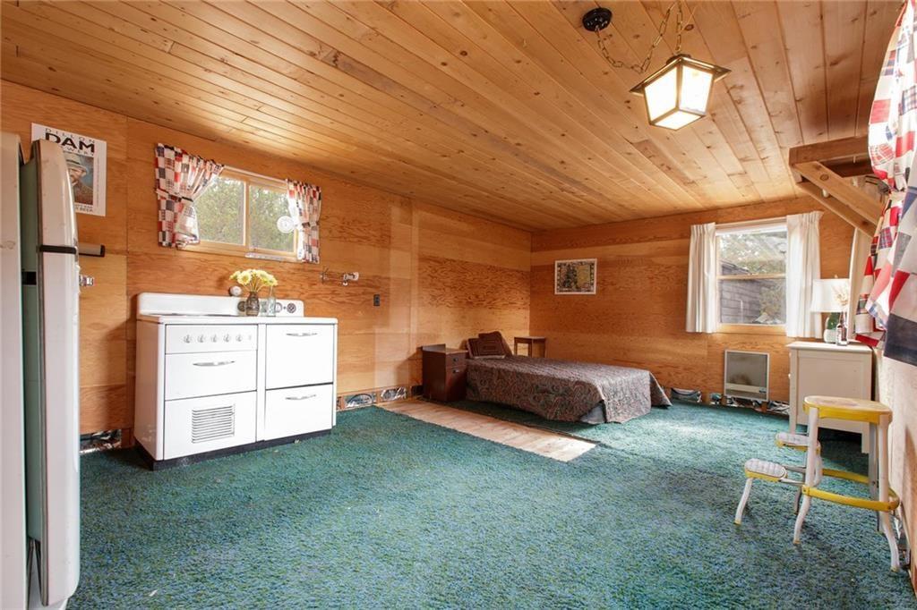 76 B Road Silverthorne, CO 80498 - Photo 14 of 25 a spacious bedroom with a bed and a cabinets