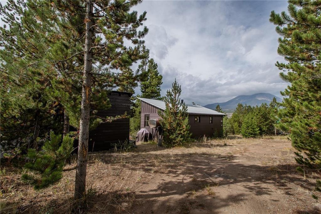 76 B Road Silverthorne, CO 80498 - Photo 5 of 25 a front view of a house with a yard and garage
