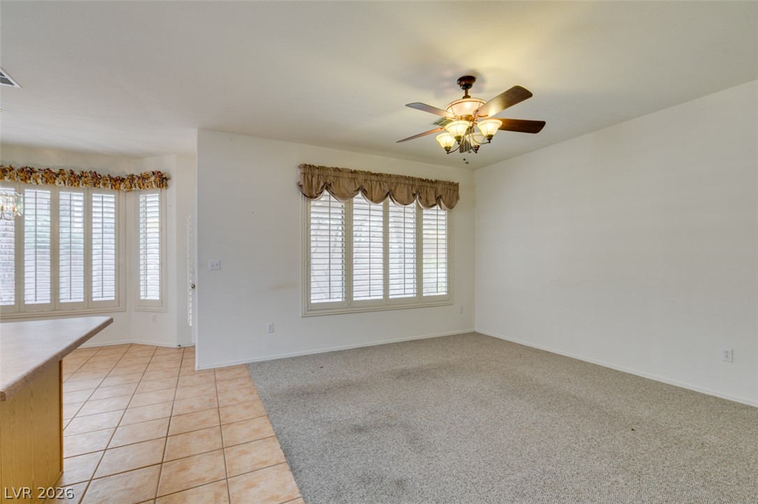 2189 Chapman Ranch Drive Henderson, NV 89012 - Photo 58 of 60 An open floorplan connects the carpeted living area with adjacent tiled spaces.