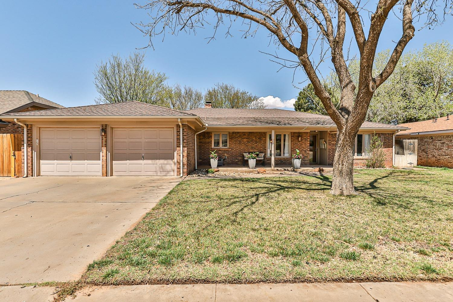 5720 68th Street Lubbock, TX 79424 - Photo 1 of 48 front view of a house with a porch
