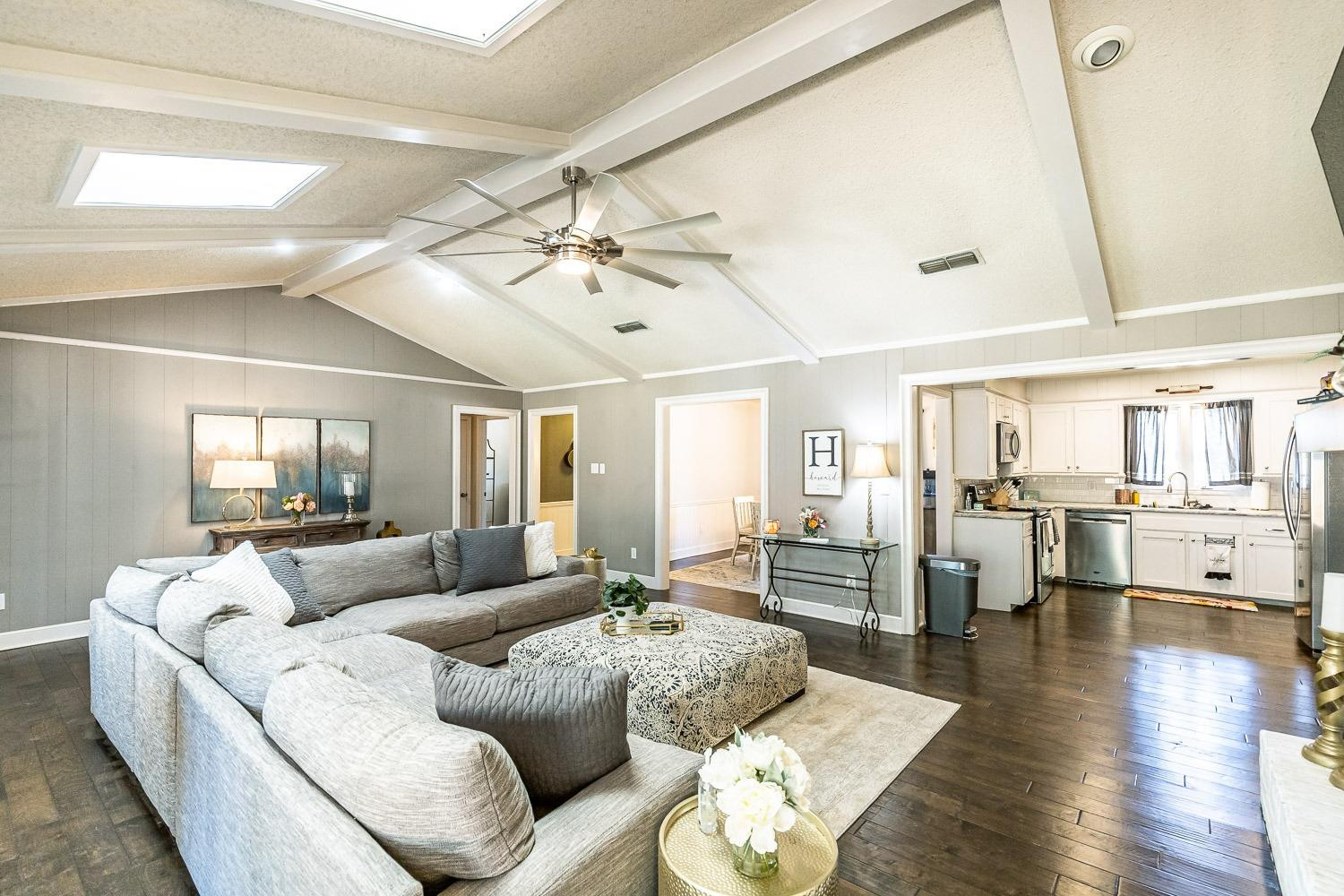 5720 68th Street Lubbock, TX 79424 - Photo 11 of 48 a living room with furniture and wooden floor
