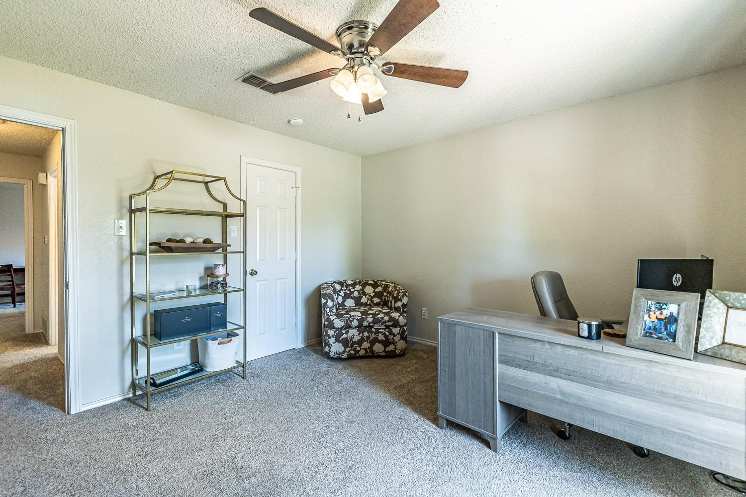 5720 68th Street Lubbock, TX 79424 - Photo 31 of 48 a bedroom with bed and window