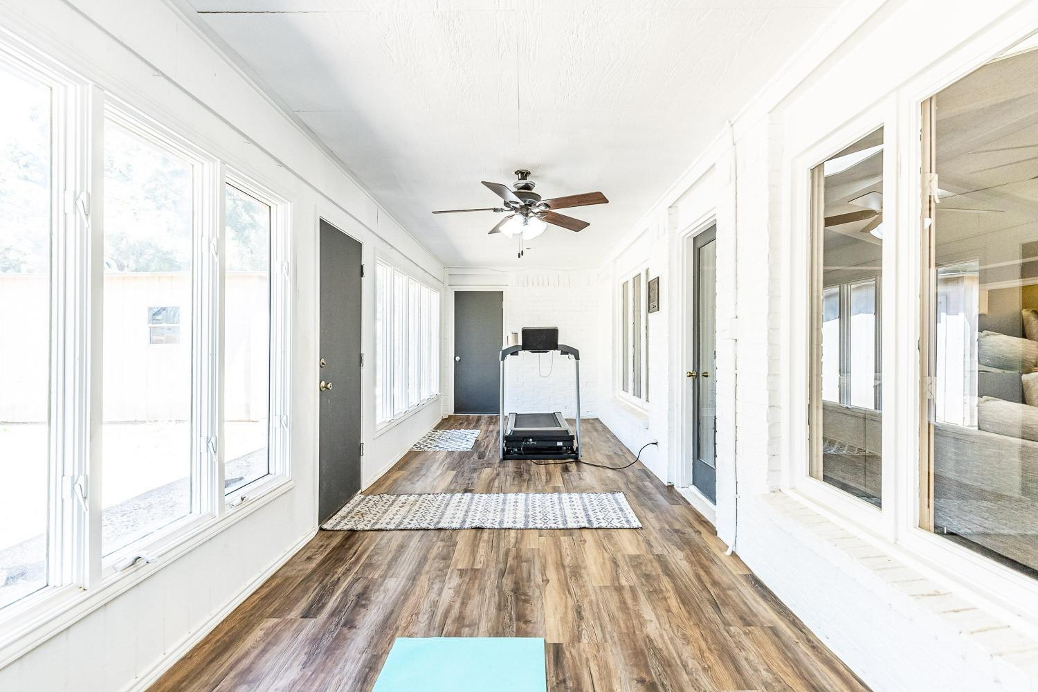 5720 68th Street Lubbock, TX 79424 - Photo 33 of 48 a view of a bedroom with wooden floor