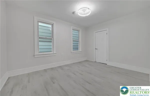 an empty room with windows