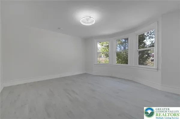 an empty room with windows