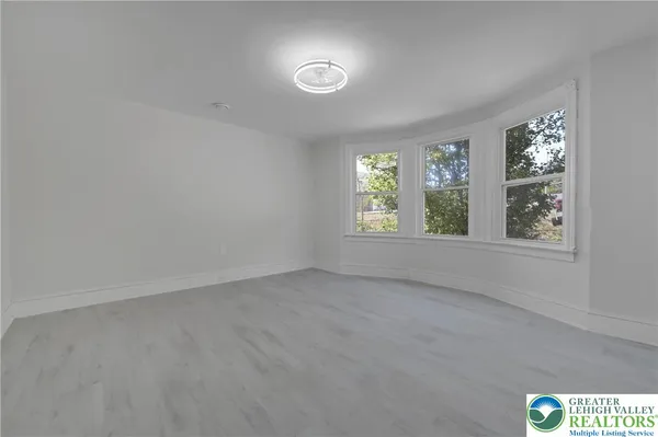 a view of an empty room with a window