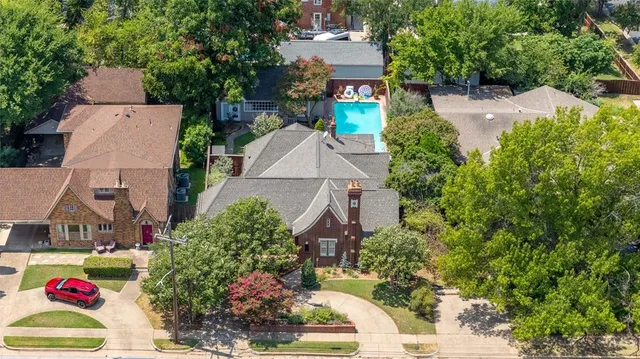 an aerial view of house with yard