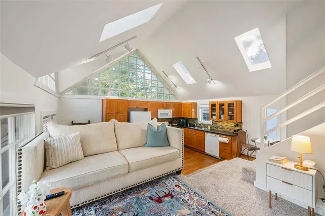 a kitchen with stainless steel appliances granite countertop a stove and a refrigerator