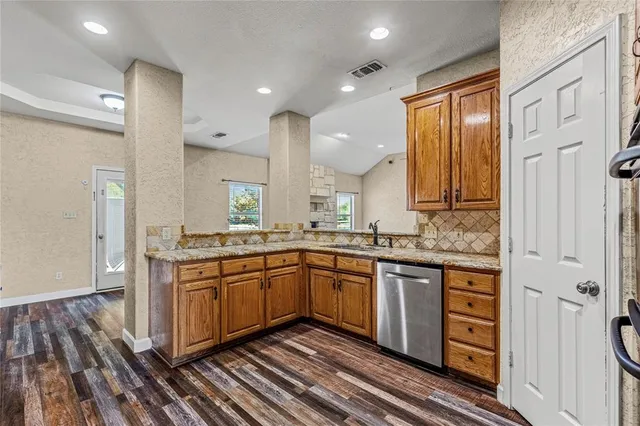 a view of cabinets and wooden floor