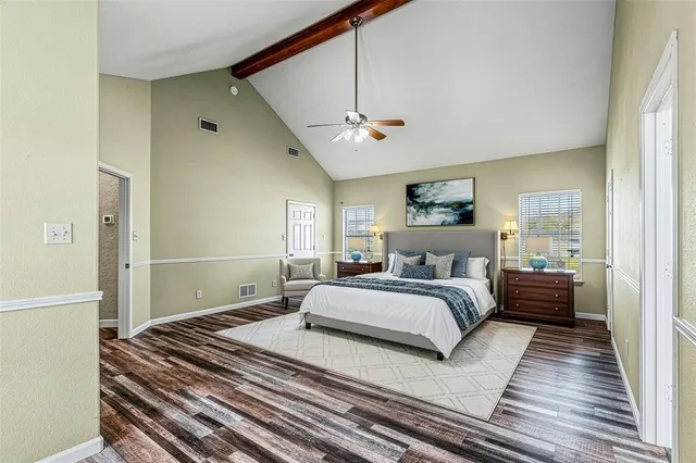 a bedroom with double bed and a chandelier