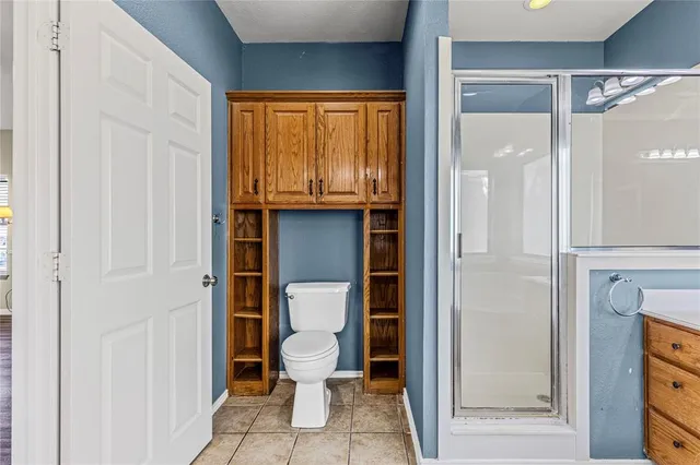 a spacious bathroom with a sink a large mirror and a bathtub